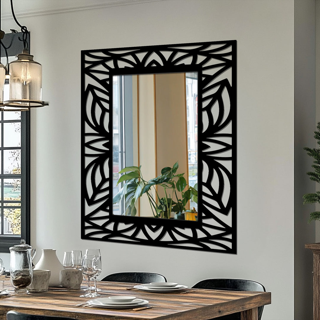 Intricate, leafy metalwork frames the tropical leaf mirror, creating depth and layers that draw the eye into the reflection with its silhouette design, enhancing modern wall mirrors.