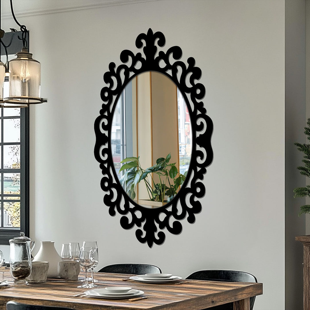 Black frames an oval bathroom mirror, reflecting a vibrant interior with a decorative, ornate scroll pattern, highlighting the wall's dominant color.