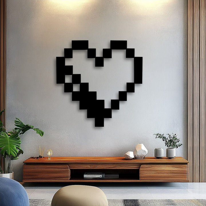 The distinct angular edges and borders of the black pixel heart create a unique metal wall art piece with a retro gaming aesthetic.