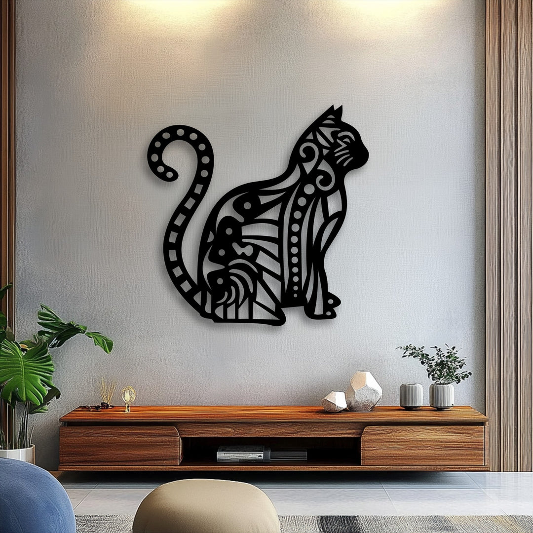 A plush blue-gray armchair and a neutral-toned round ottoman are visible in the foreground, complementing the patterned cat decoration wall art.