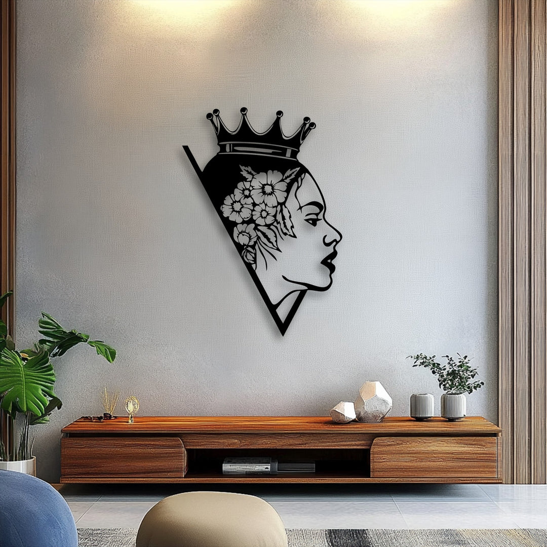 The smooth, elegant surface of the floral queen silhouette decorative metal art sharply contrasts with the subtle, fine-grained texture of the light gray wall.