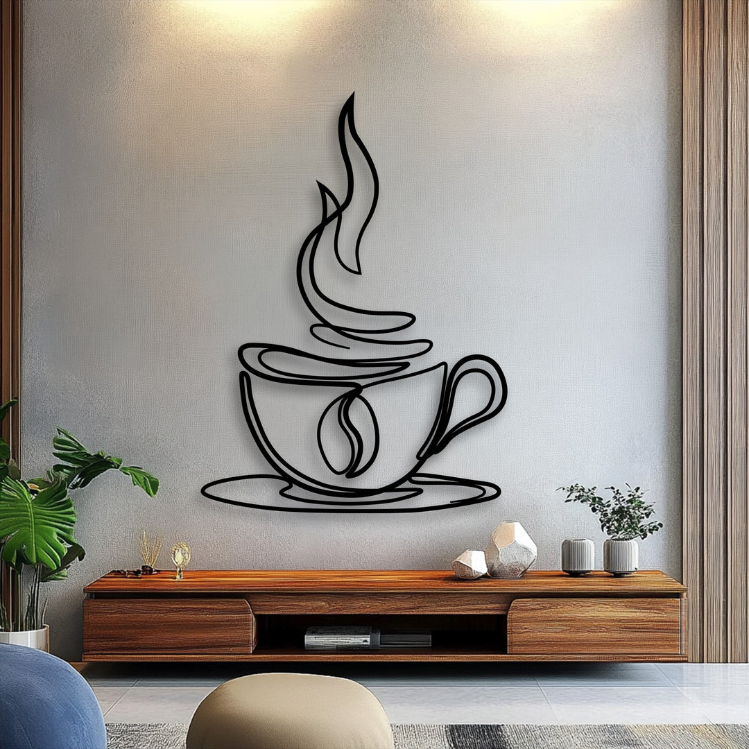 The brightest area of the textured wall subtly illuminates the elegant coffee cup line art decorative metal art.
