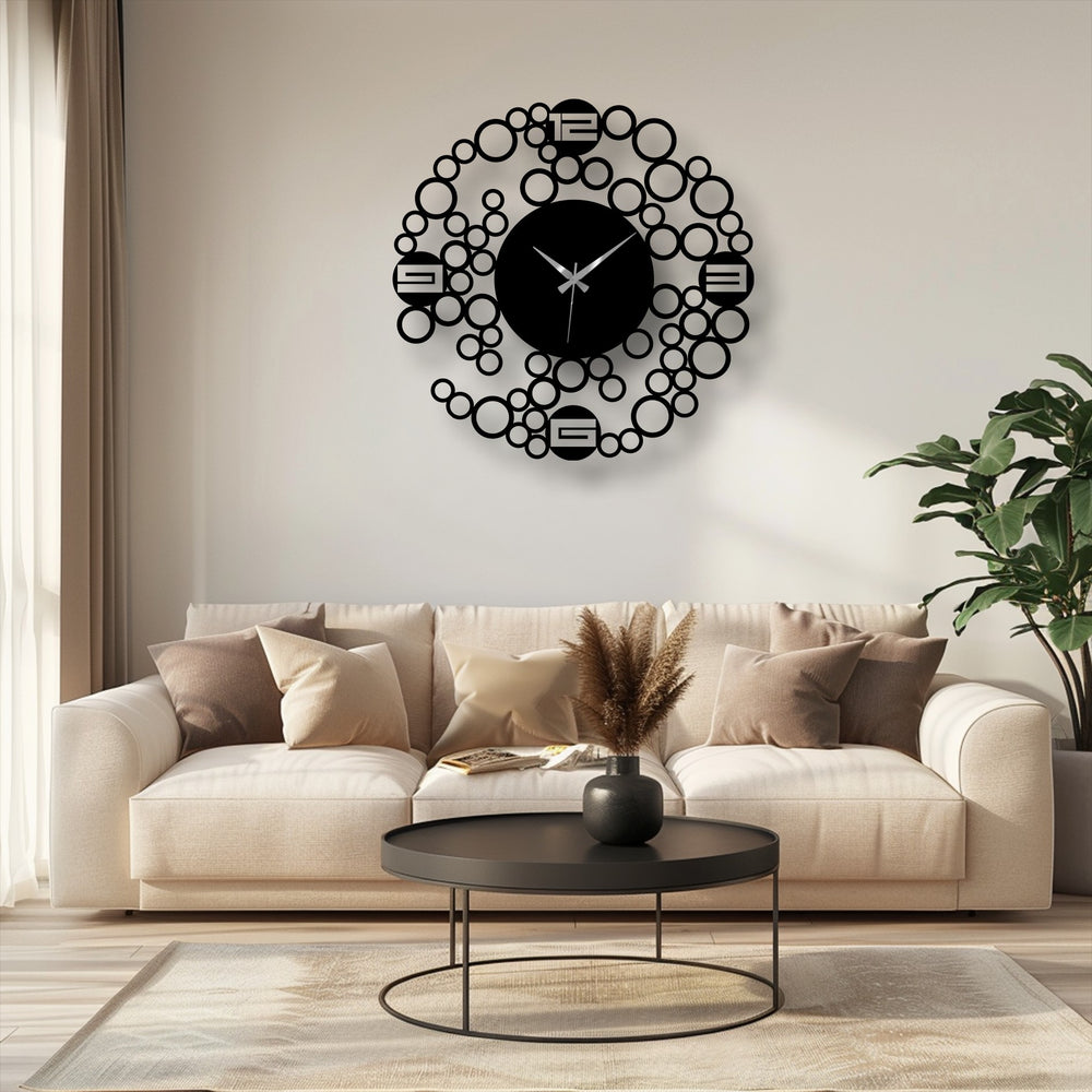 Outlined by its circular edge, this metal artwork creates a focal point as a modern bubble ring wall clock, offering a minimal geometric design within its bordered form.