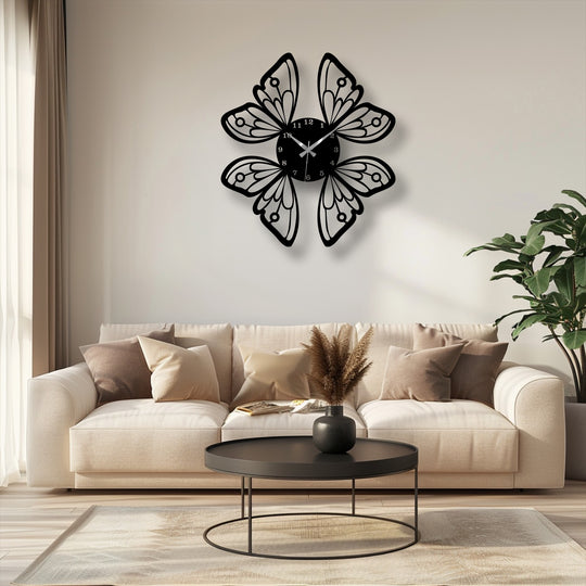 The graceful butterfly wings of this metal artwork wall clock seem to flutter, creating a dynamic sense of motion above the comfortable sofa.