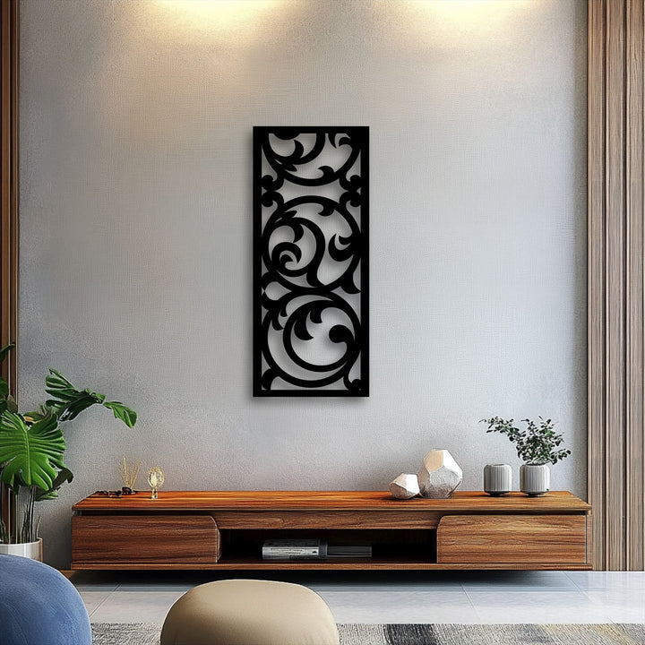 A subtly textured wall provides a refined backdrop for the smooth matte finish of the ornate floral scroll metal artwork, enhancing its elegant design.