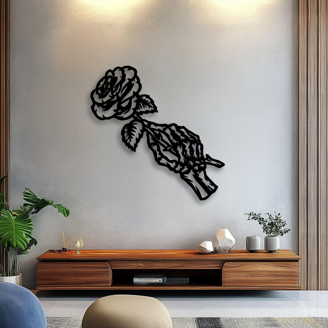 Diagonally oriented Gothic floral metal artwork, featuring an intricate skeleton hand gripping a delicate rose silhouette.