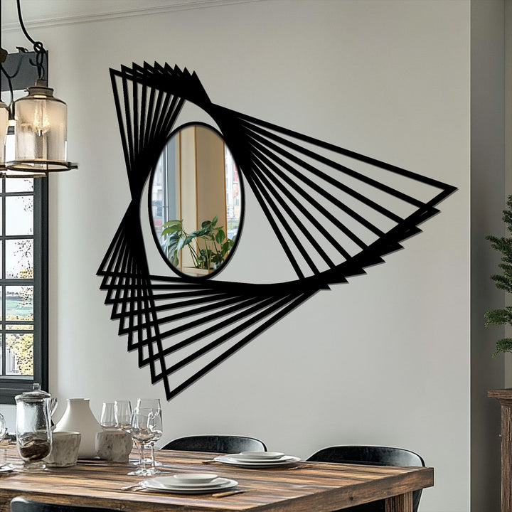 Light and shadow play across the angular motion lines of this abstract geometric mirror, highlighting the impact of decorating with wall mirrors on the surrounding space.