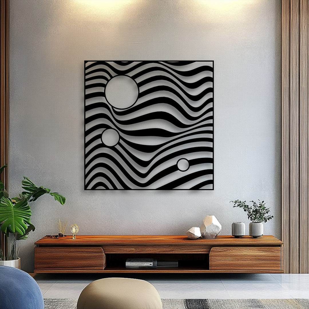 The dramatic interplay of light and shadow highlights the undulating patterns and geometric circles of the unique metal wall art, creating sculptural depth.
