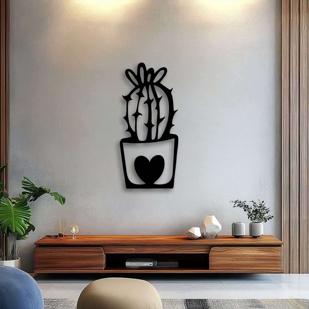 The stillness of a cute cactus metal wall decor with a heart pot design on a textured light gray wall offers a peaceful minimal plant aesthetic.