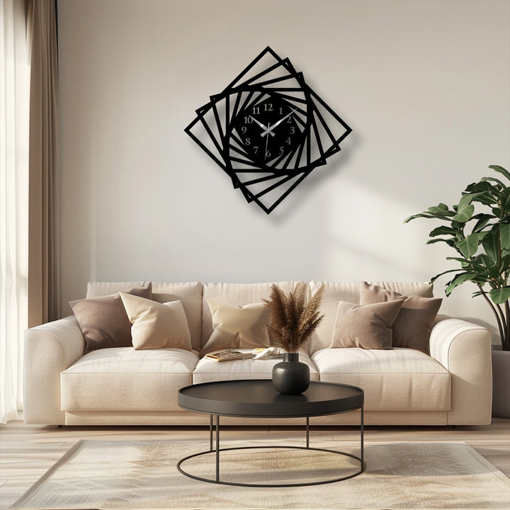 The room's cool, desaturated palette highlights the geometric spiral frame decorative metal art wall clock above a cream sofa.