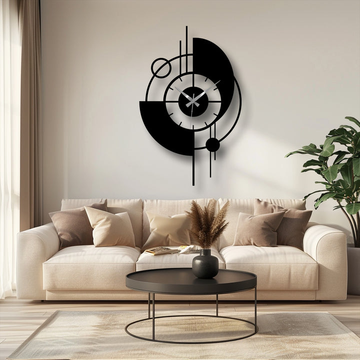 Horizontally oriented, the circular and geometric modern orbit abstract metal artwork clock features a contemporary design with bold shapes.