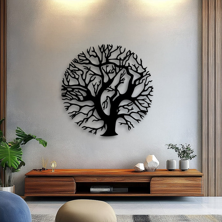 Framed by distinct wooden borders, the sleek, round edge of the black Tree of Life metal wall decor offers a striking contrast against the pale wall.