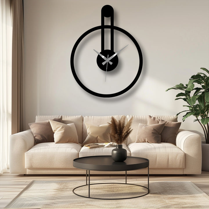 Showcasing the realistic detail, this minimalist metal wall clock is an example of unique metal wall art with its circular shape and vertical accent.