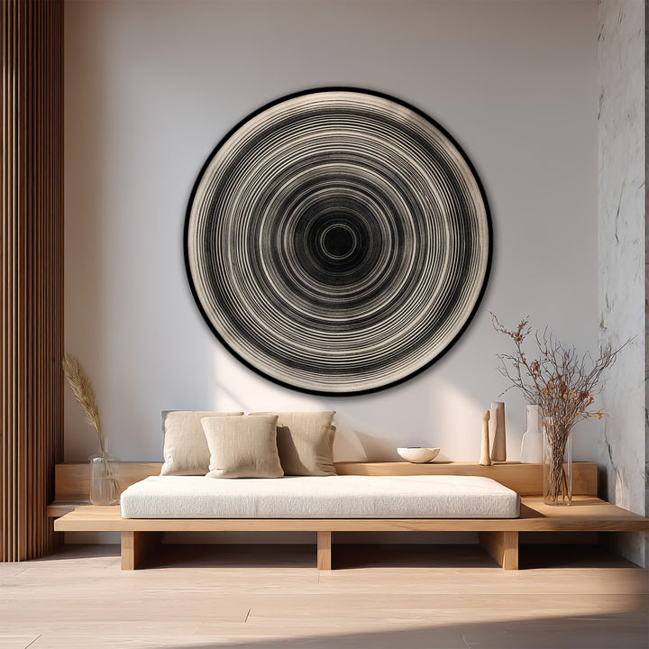 Bright, neutral wall highlights a minimalist circular oil painting wall art, creating a serene backdrop for the monochrome concentric design.