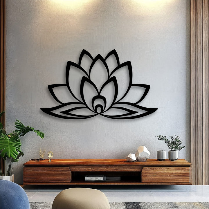 The subtle transition from warm, illuminated cream to cooler grey on the wall highlights the unique metal wall art of a minimalist lotus bloom.