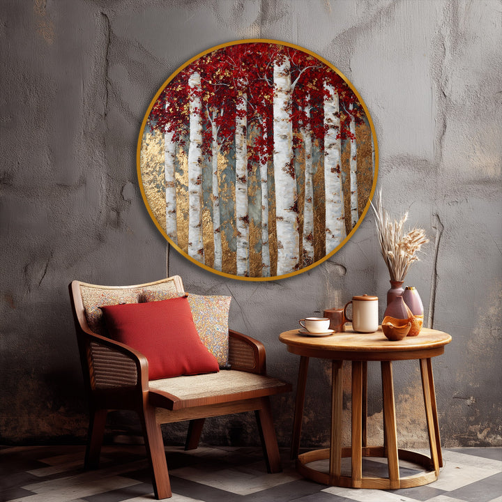 Vibrant color contrast defines this striking round canvas pictures print, showcasing a golden birch forest with vivid red leaves that pop against the textured gray wall.