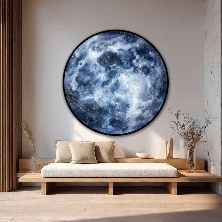 Negative space highlights the round Midnight Nebula oil painting wall art, its deep blue abstract forms creating a dramatic focal point.