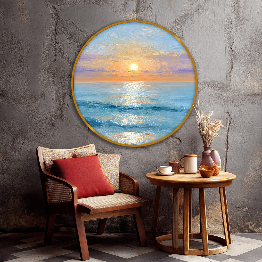 Displaying organic forms, a serene coastal framed canvas depicts a golden sunrise over a calm ocean in round canvas wall art.