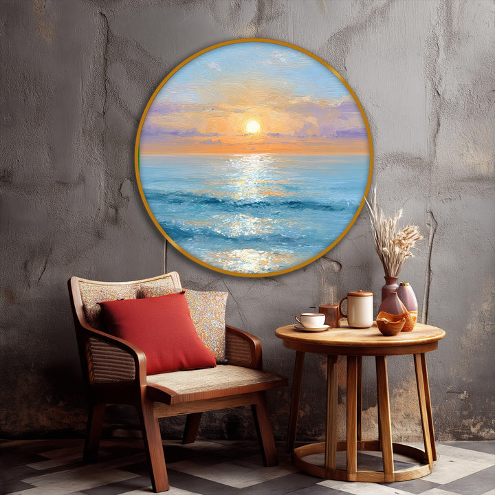 Displaying organic forms, a serene coastal framed canvas depicts a golden sunrise over a calm ocean in round canvas wall art.