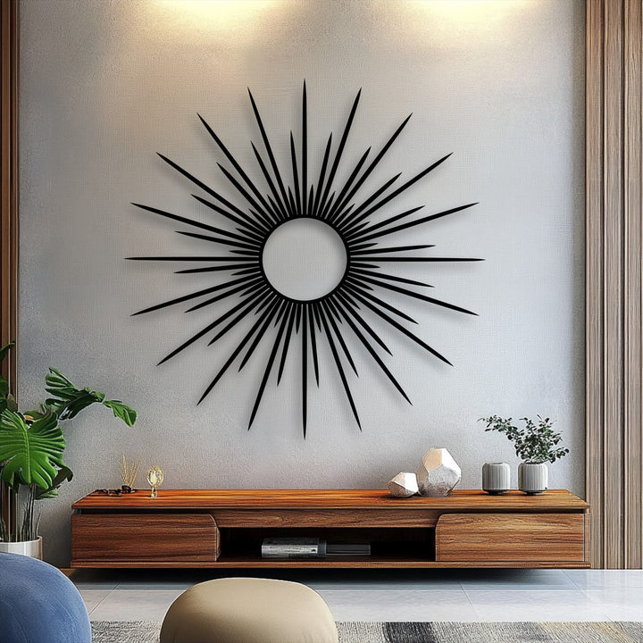 The brightest area on the textured wall reveals a soft, radiant glow above the striking sunburst metal art for wall, enhancing its modern abstract design.