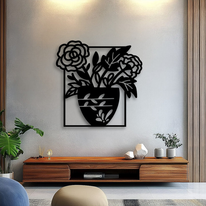 A modern wooden console table, adorned with diverse decorative objects, sits in the foreground below the striking unique metal wall art.