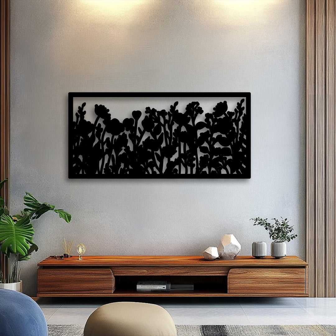 The stark contrast of light and shadow highlights the intricate wildflower silhouette on this unique metal wall art, showcasing its modern botanical garden design.