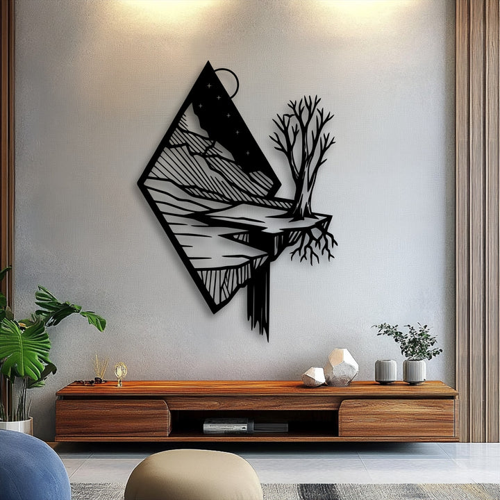 Warm lighting accentuates this unique metal wall art showcasing a floating mountain landscape with a lone tree.
