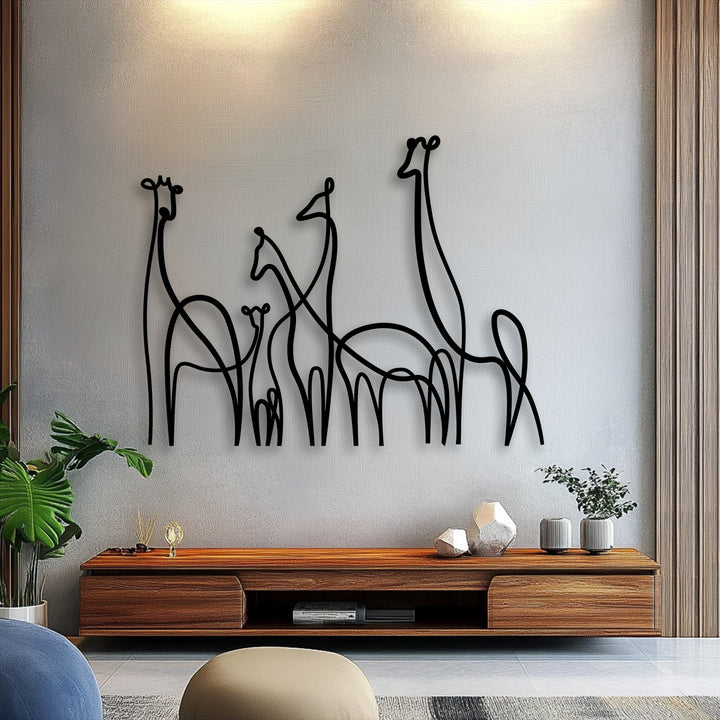 Warmly lit decorative metal art shows a minimalist giraffe family line art piece over a console, creating an inviting ambiance.