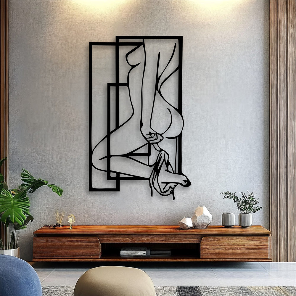 Warm wall luminescence subtly shifts to cool grey, enhancing the striking black abstract feminine silhouette metal art for wall, framed by sharp geometric lines.