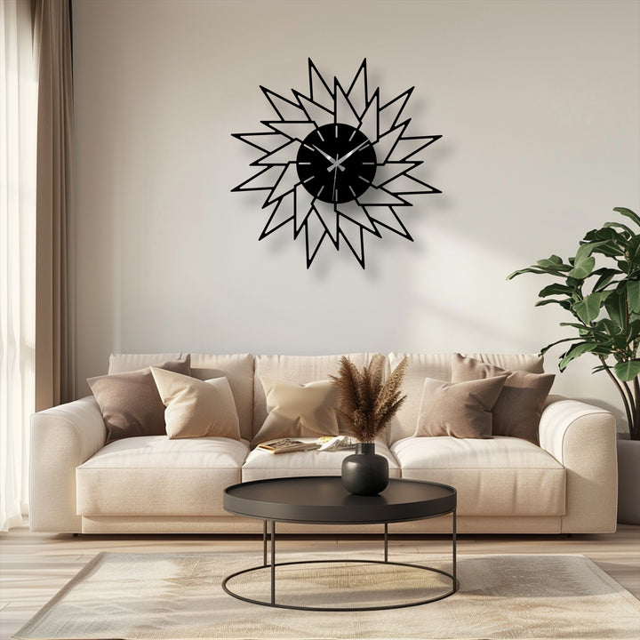 The slightly coarse surface texture of the modern, geometric starburst metal wall decor complements its bold design, while the black finish adds a sleek touch.