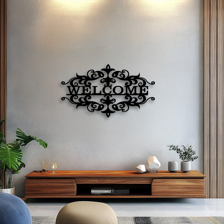 Negative space masterfully outlines the elegant 'WELCOME' text and intricate flourishes of this unique metal wall art against a neutral wall.