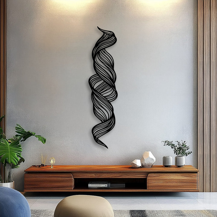 Layered black metal artwork forms an intertwined twisted flow, creating a dynamic, sculptural, and modern vertical accent.