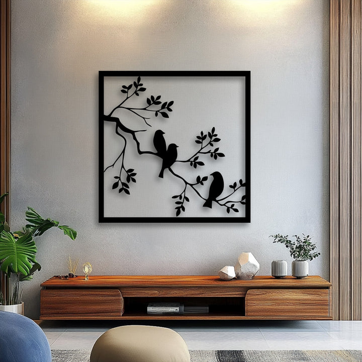 The organic forms of three graceful birds perched on an intricate branch in this metal art for wall offer serene nature silhouette decor.