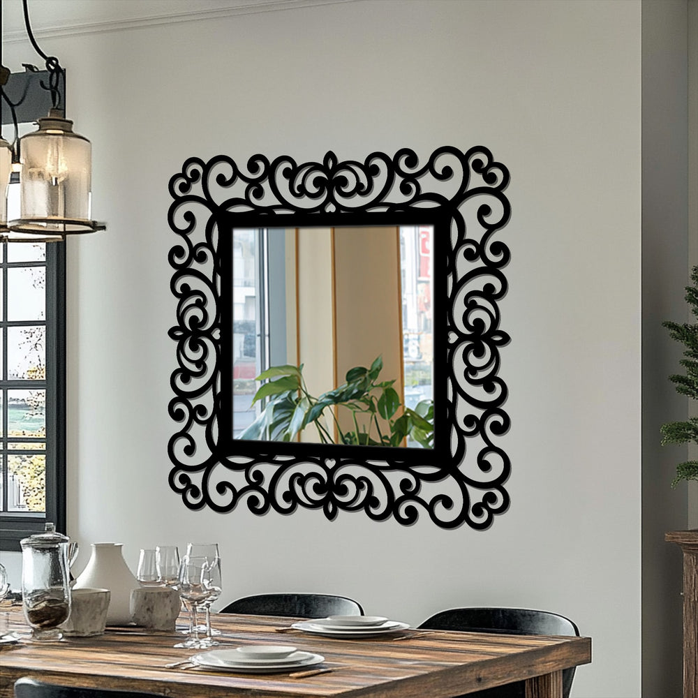 High color contrast highlights the unique metal wall art of the ornate vintage baroque framed wall mirror against the light wall.