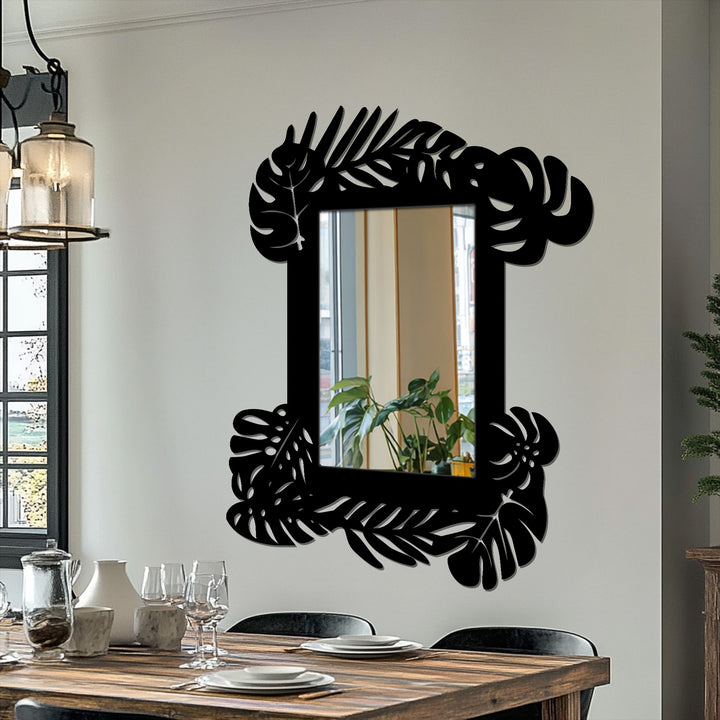 Multiple layers of the botanical frame emphasize depth within the reflected image of indoor plants in this tropical leaf framed wall mirror.