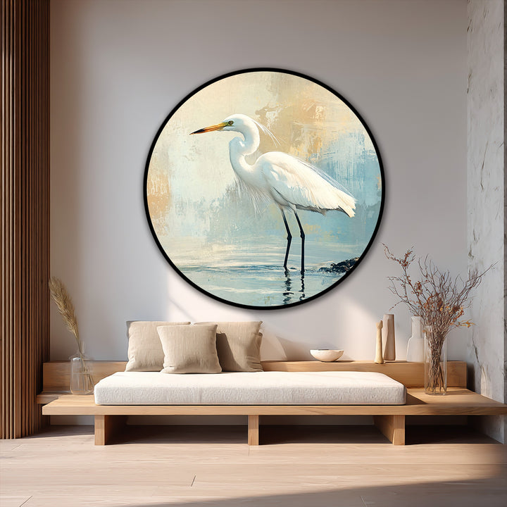 Encircling the serene coastal oil painting art piece of a white egret is a bold black circular border, enhancing the artwork's morning stillness.