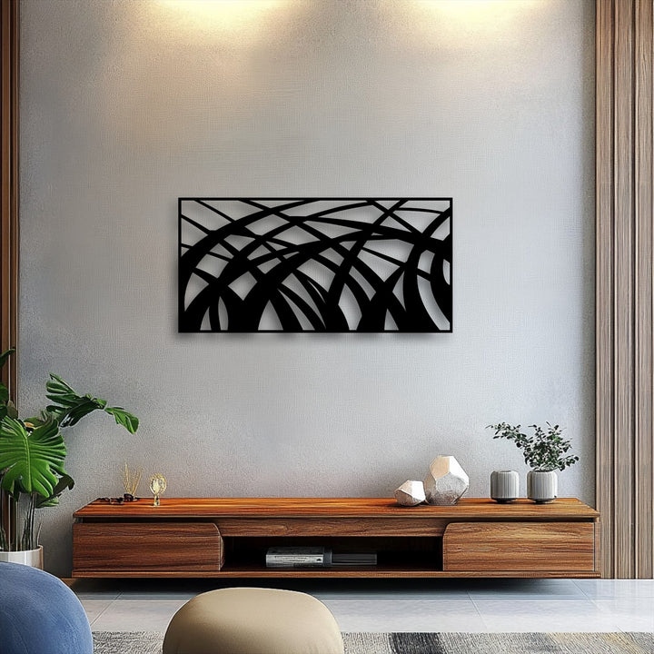 Warmly lit abstract flowing lines metal artwork enhances the modern geometric wave panel, creating a cozy ambiance.