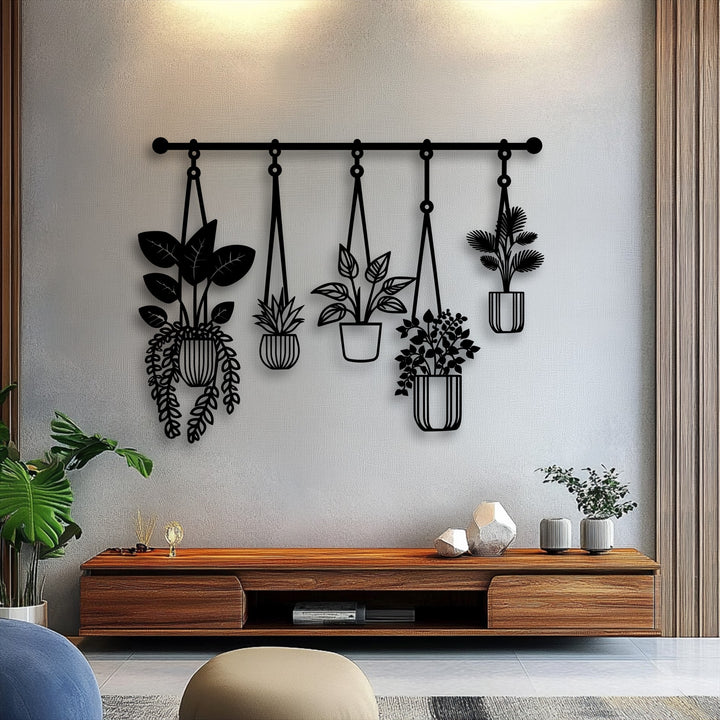 The flowing lines of this hanging plants metal decoration wall art create a dynamic sense of natural movement above a console.