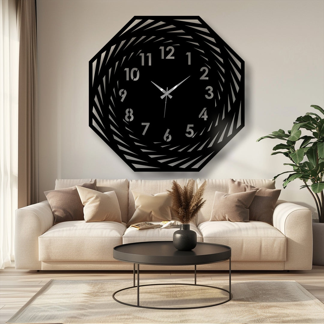 Negative space creates a spiral effect within the modern metal art for wall of this geometric wall clock, adding depth to its unique design.