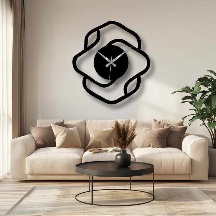 Highlighting the focal point, a modern abstract organic shape metal wall clock presents a unique metal wall art display against a light neutral wall backdrop.