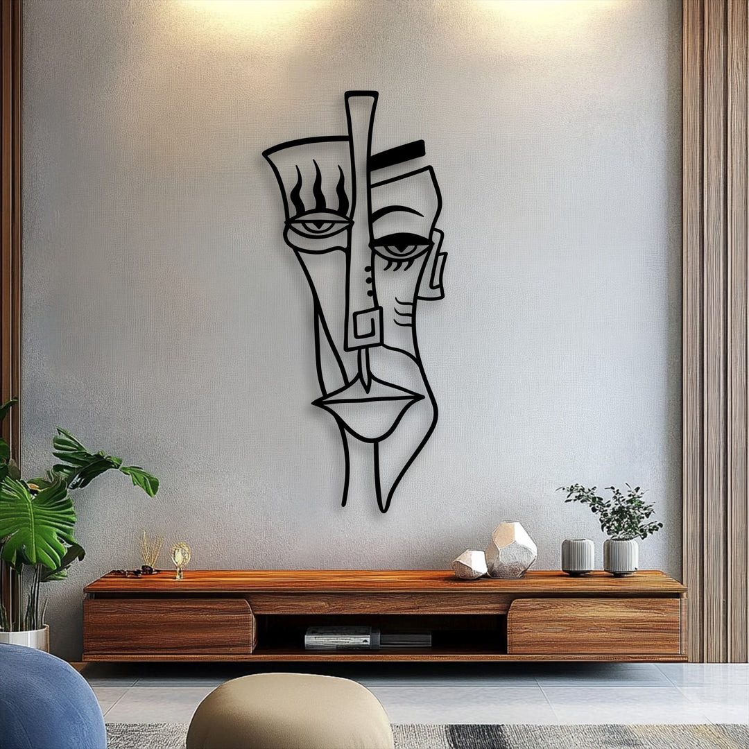 An intriguing, modern mood is set by the unique metal wall art featuring an abstract tribal face, creating a sophisticated statement piece.