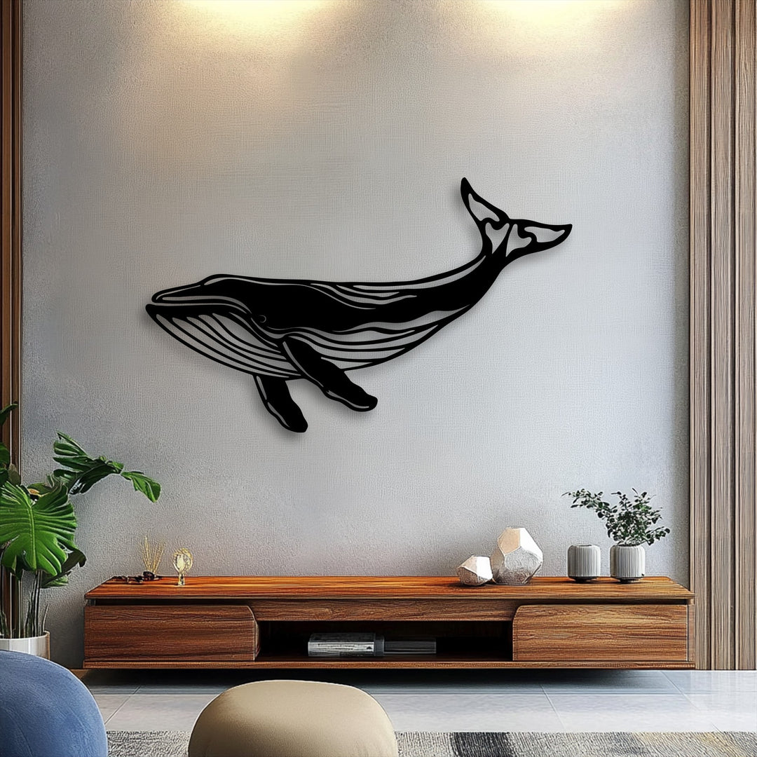 With balanced color saturation, a striking unique metal wall art of a majestic whale silhouette provides a bold focal point above a wooden console.