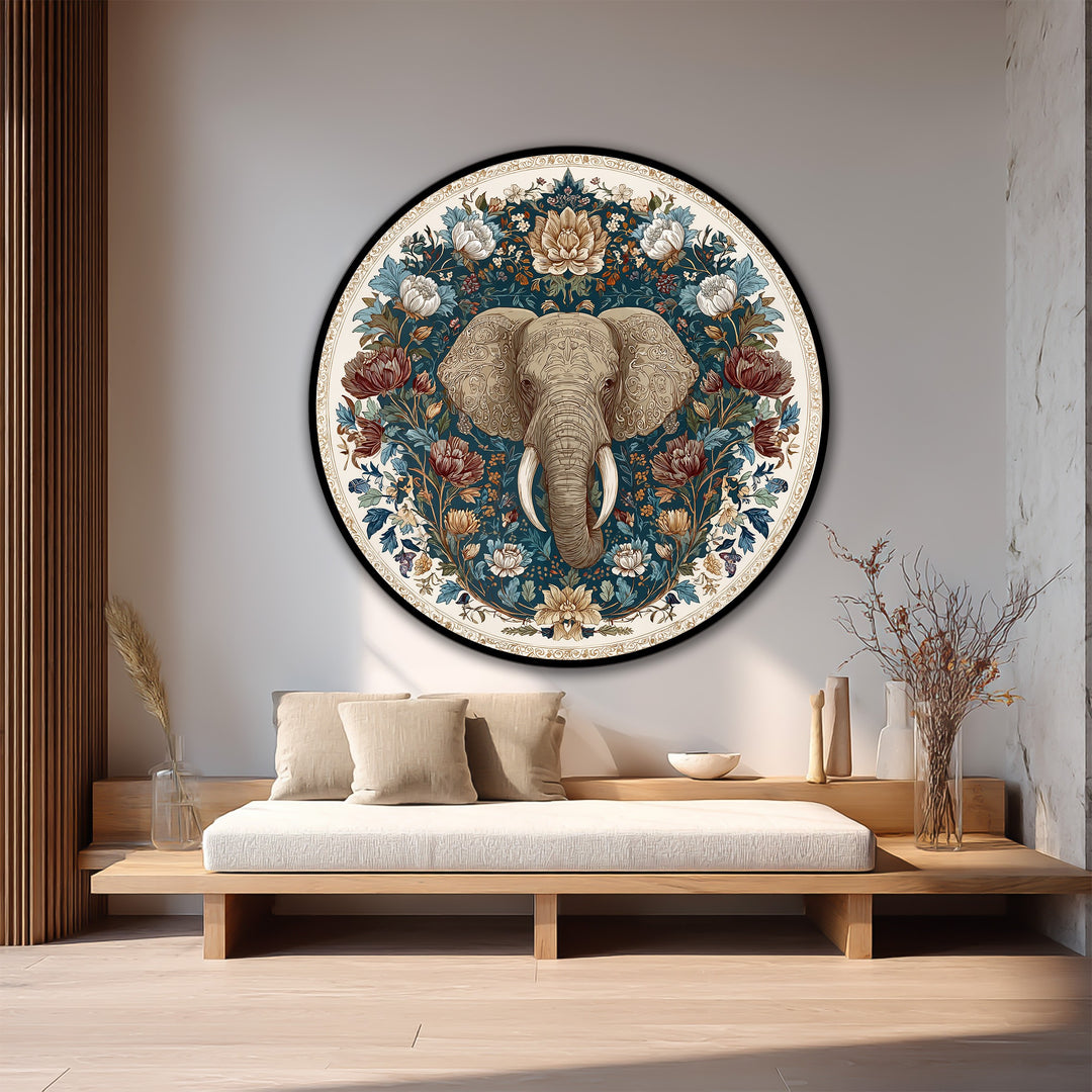 Framed in black, the circular floral majesty elephant decorative wall art is highlighted by its intricate edge detail and the subtle borders of the wood canvas.
