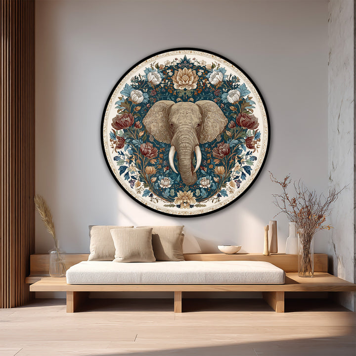 Framed in black, the circular floral majesty elephant decorative wall art is highlighted by its intricate edge detail and the subtle borders of the wood canvas.
