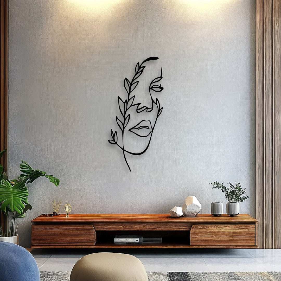 Wall's subtle color transition from warm glow to cool gray texture frames black botanical minimalist female line art decorative metal art.