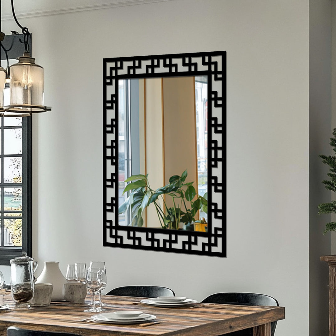 Reflecting ambient light, this decorative mirror features a geometric maze pattern in black metal, adding a modern touch with stylish metal wall decor.