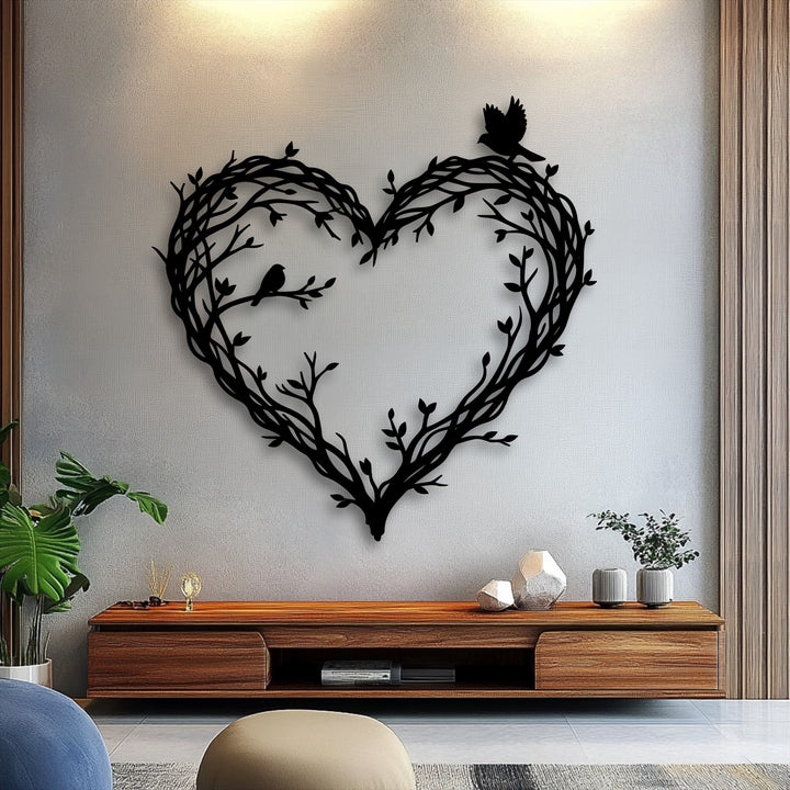 Delicate birds and branches intertwined to form a heart bring a soft, natural touch to this elegant metal wall decor.
