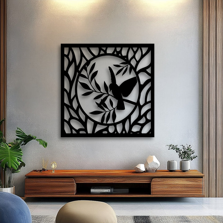 Elegant metal wall decor, a graceful bird in a nature circle, displays intricate depth and layers with its shadows on the light wall.