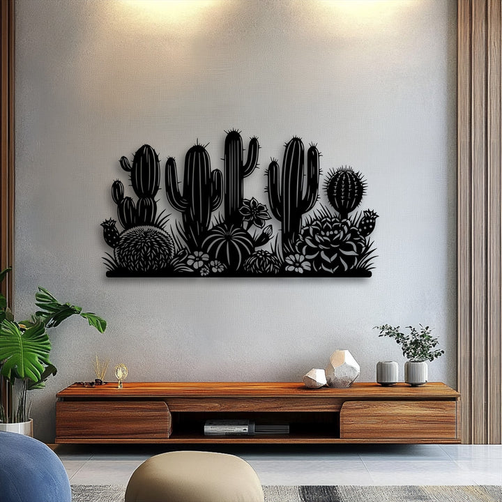 The subtly textured white wall highlights the crisp, smooth surface of the desert cactus garden silhouette metal wall decor.