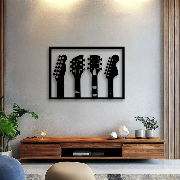 Showcasing exceptional material quality, this bold metal art for wall features four precisely cut guitar headstock silhouettes.